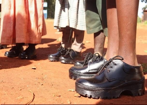 Donating of shoes to school going children of Kiringalia primary